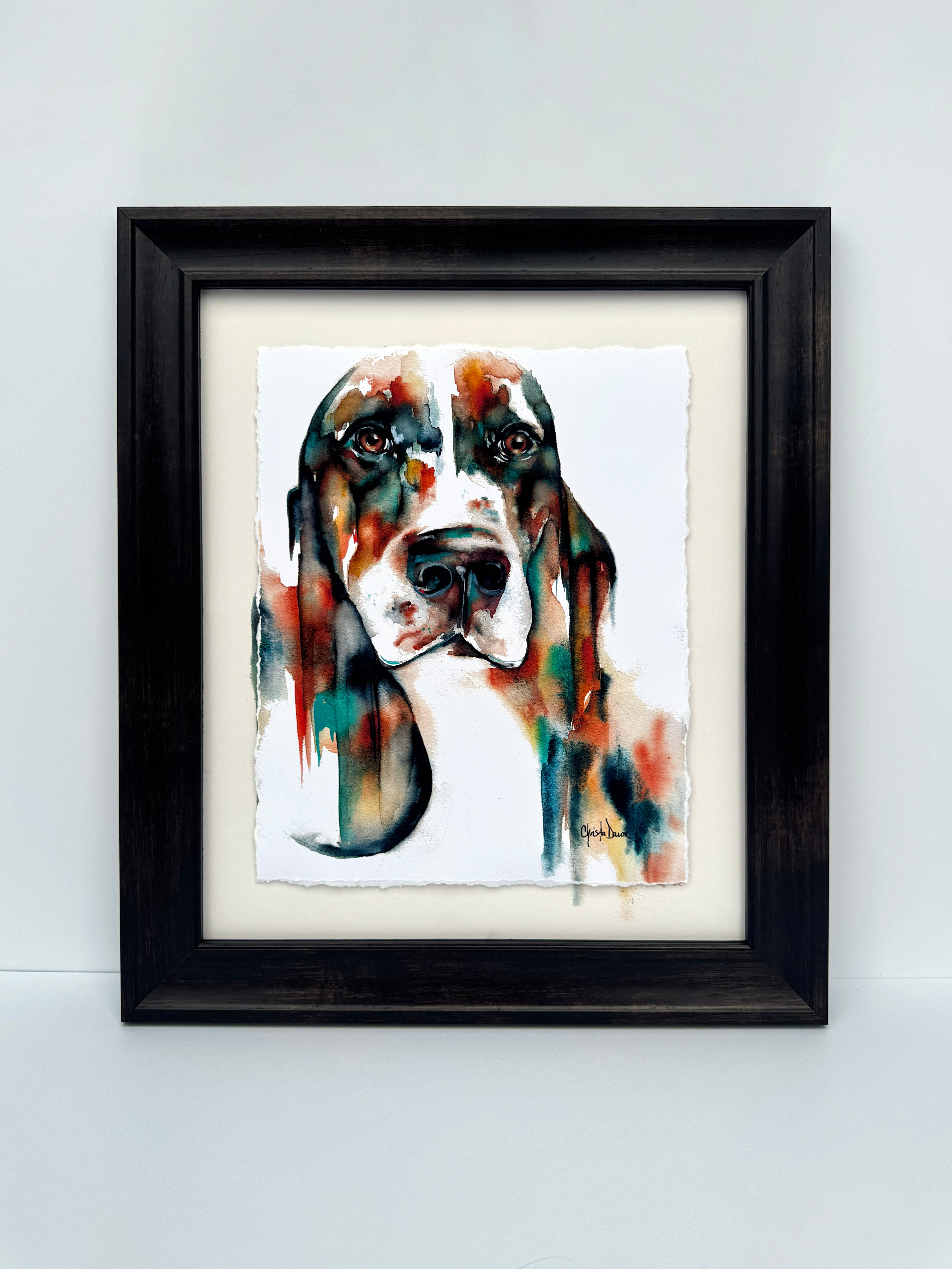 Bold colored watercolor basset on paper with soulful eyes